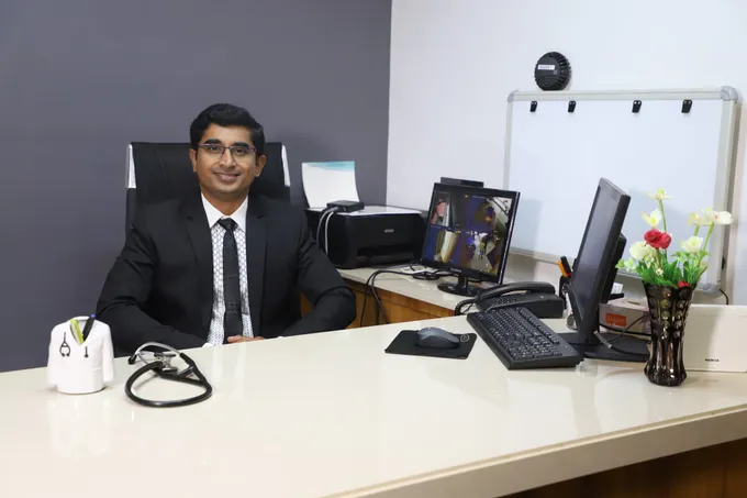 Dr. Ravindra Sangolkar at his consultation desk at Sangolkar Heart Care Center